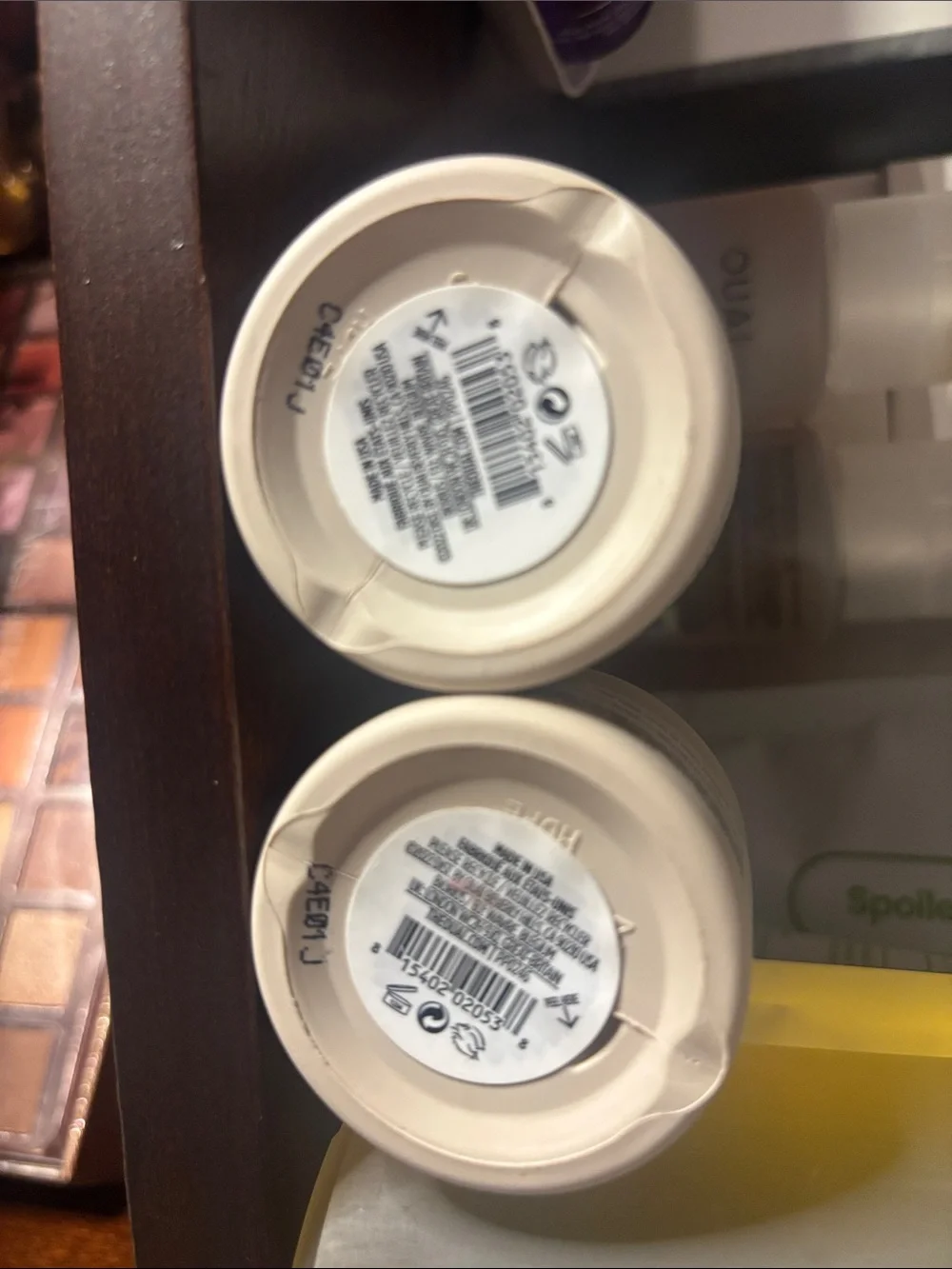 OUAI cream moisturizer jars in off-white